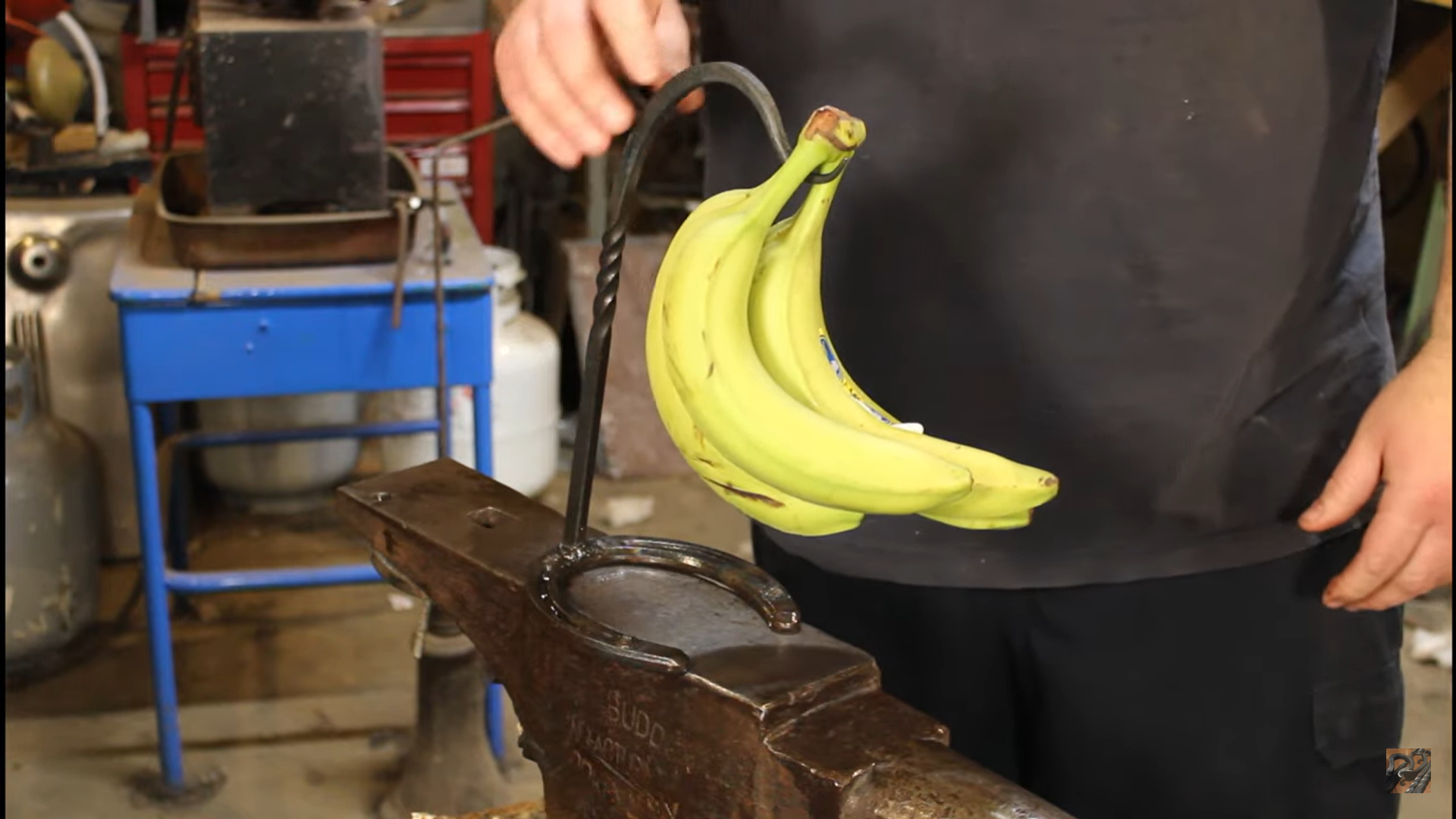 Forging a banana hanger with a horse shoe base